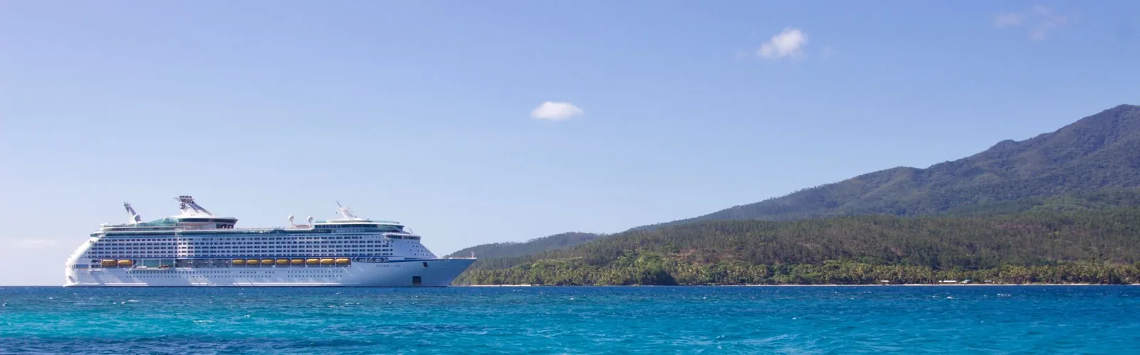 Cruise ship at port, showing the cost of protecting your trip
