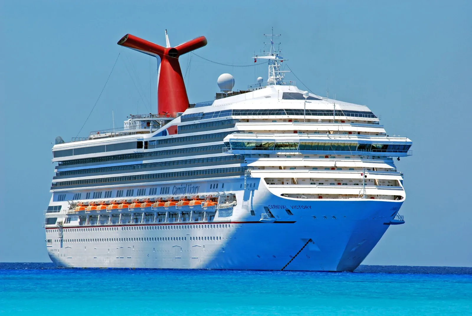 Traveler comparing cruise insurance quotes on a laptop